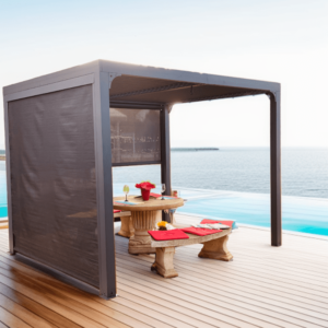 PER 24R30R BI Pergola bioclimatique ALUMINIUM balcon et terrasse coloris gris anthracite avec rideau manuel coloris gris pour côté 3 m et rideau manuel coloris gris pour côté 2,40 m / Surface de protection : 7,20 m² / toit réalisé avec lames ovales en aluminium / Garantie : structure 5 ans ventelles 2 ans rideaux 1 an*